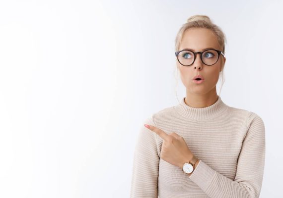 woman-social-blogger-looking-up-pointing-upper-left-corner-folding-lips-impressed-stunned-awesome-idea-white (2) (1)